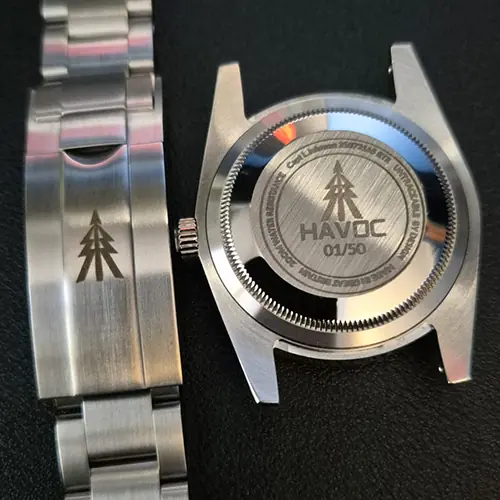 The rear of a Havoc watch and bracelet clash, both featuring the Havoc logo.